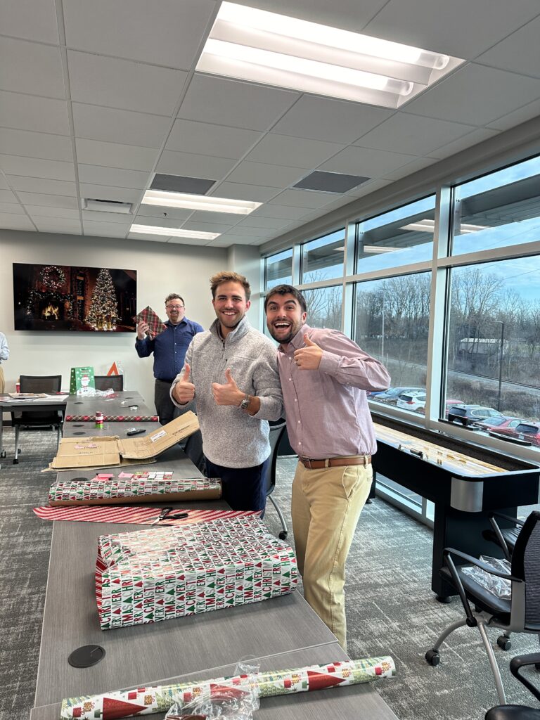 A team from Advantage wrapping gifts